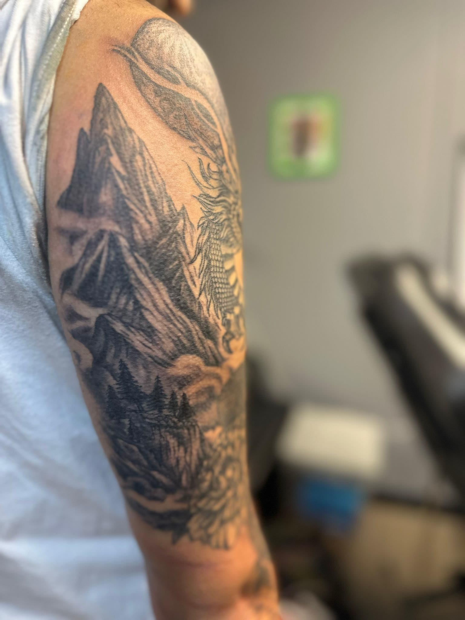 Mountains and landscape on back of arm